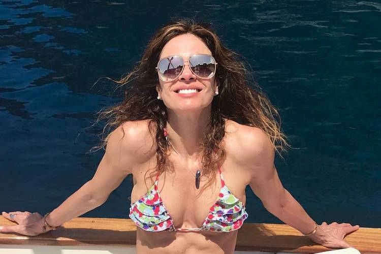 Luciana Gimenez exibe barriga sarada em show do ex, Mick Jagger