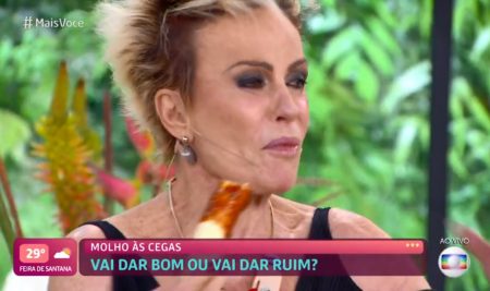 Ana Maria Braga come molho de pimenta com banana, passa mal e pede ajuda