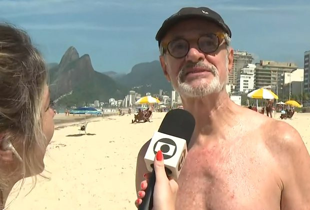 Marcos Caruso é flagrado pela Globo durante passeio com o marido na praia